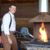 A blacksmith at the Agricultural Heritage Center